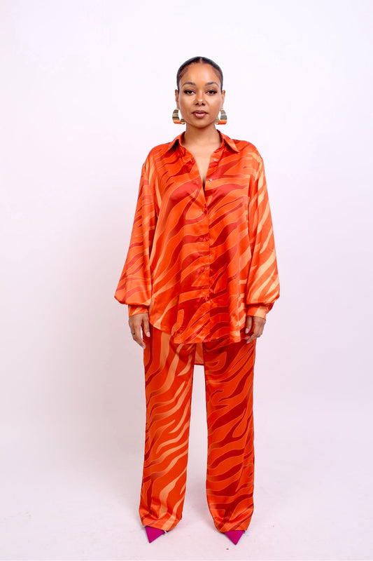woman wearing oversized shirt and wide leg trousers